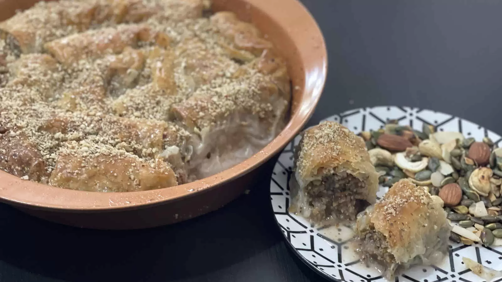 Baklava in an oven dish and a piece of Baklava on a plate