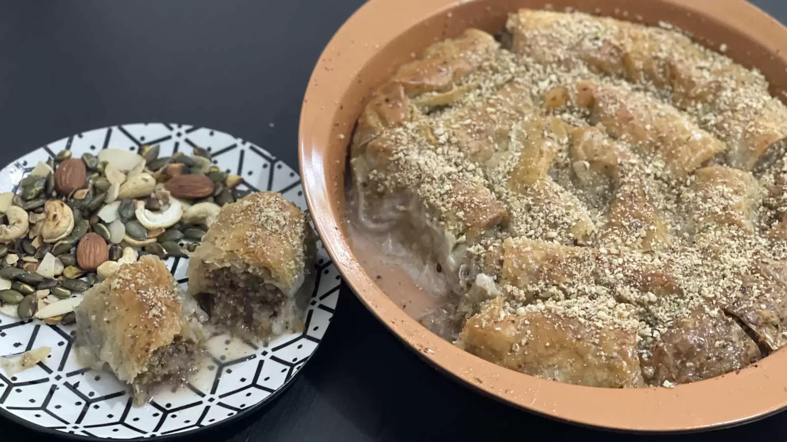 Baklava in an oven dish and a piece of Baklava on a plate