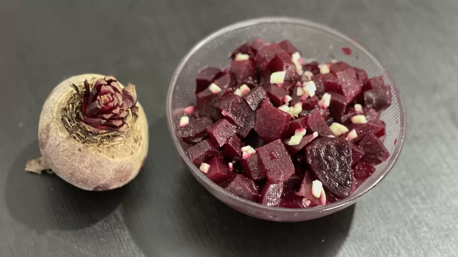 Beets Beets dish in a bowl next to beets on a table