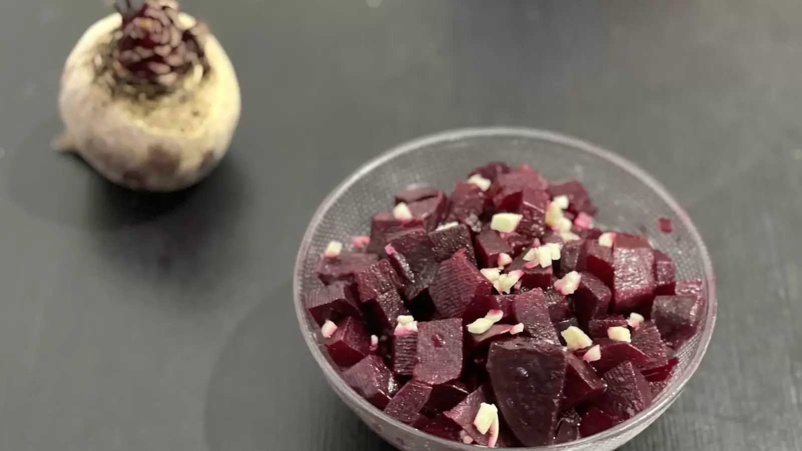 Beets Beets recipe in a bowl next to beets on a table