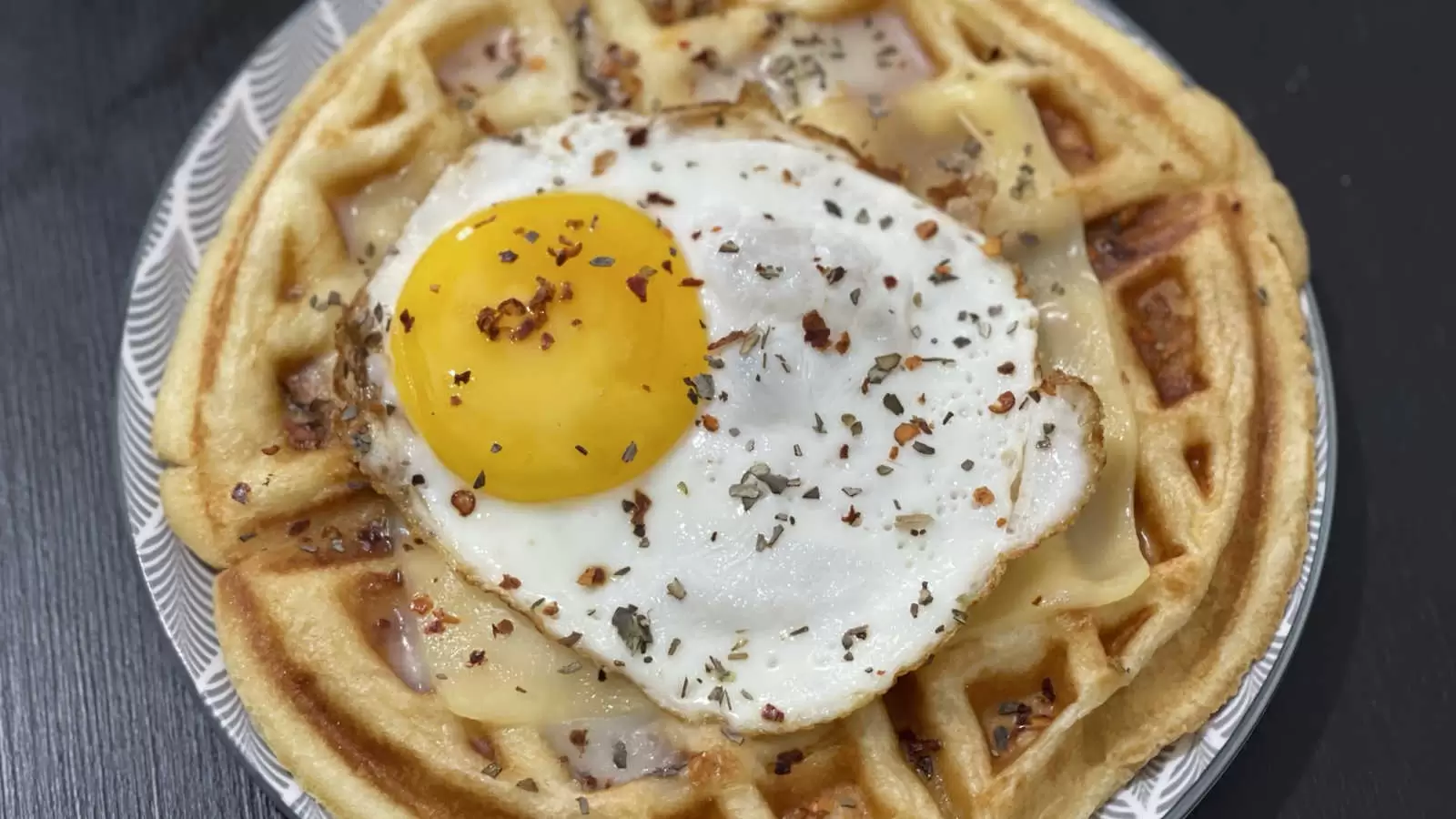 Belgian waffle with egg and cheeses for breakfast