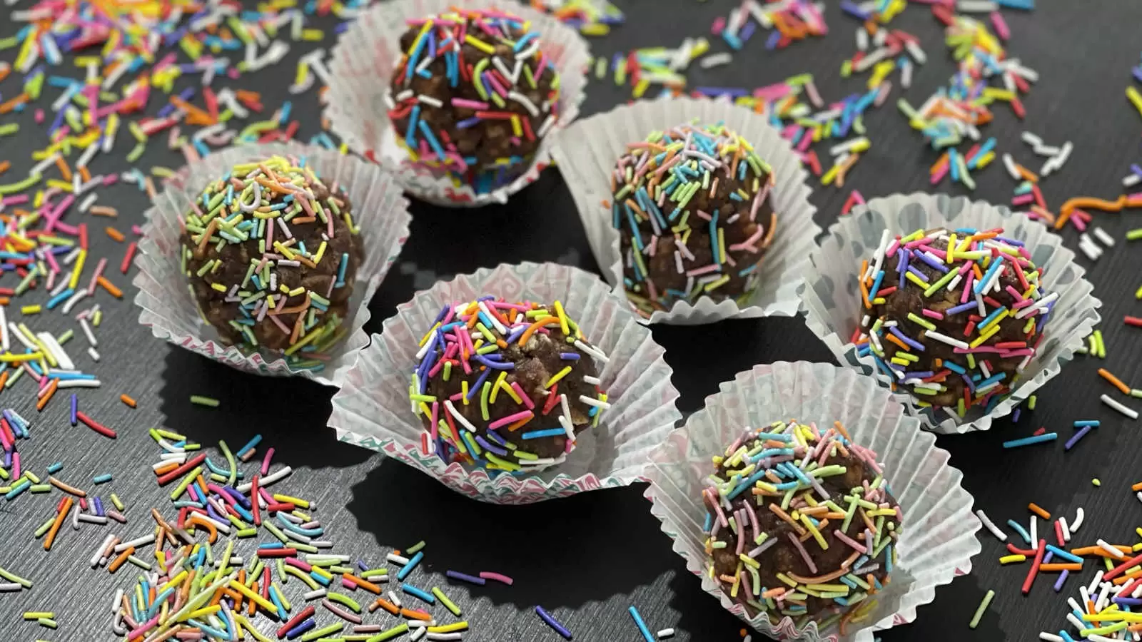 Chocolate balls recipe with rainbow sprinkles in baking cups