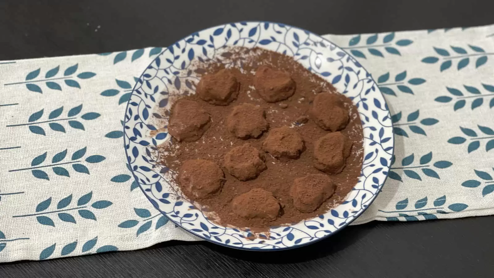 Chocolate banana truffles dessert on a plate and under a napkin