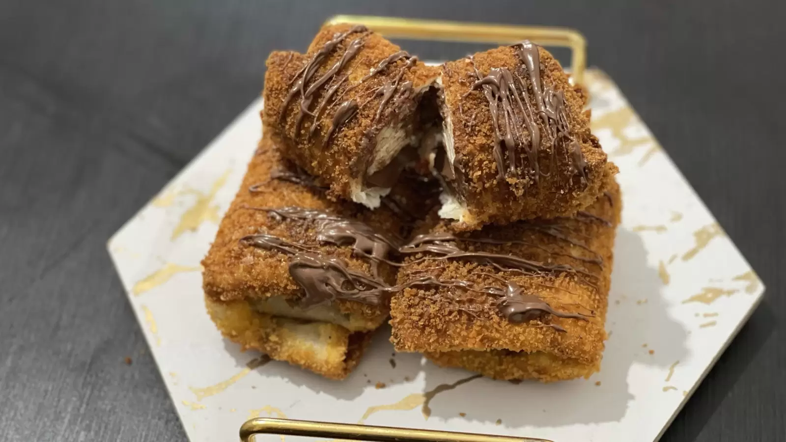 Chocolate filled tortilla dessert on a tray