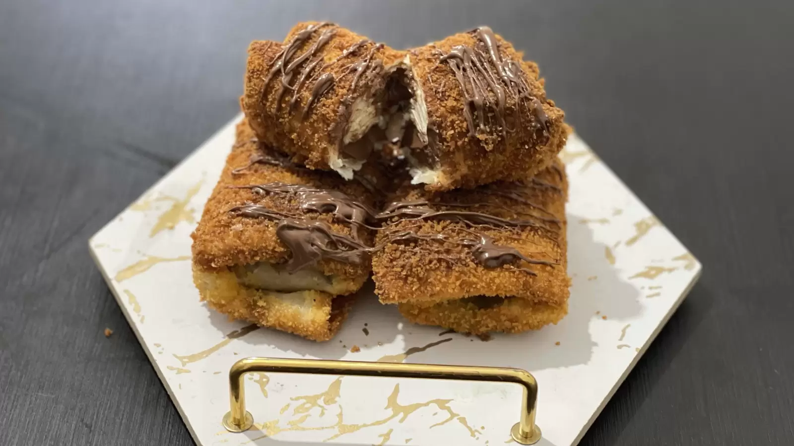 Chocolate filled tortilla dish on a tray