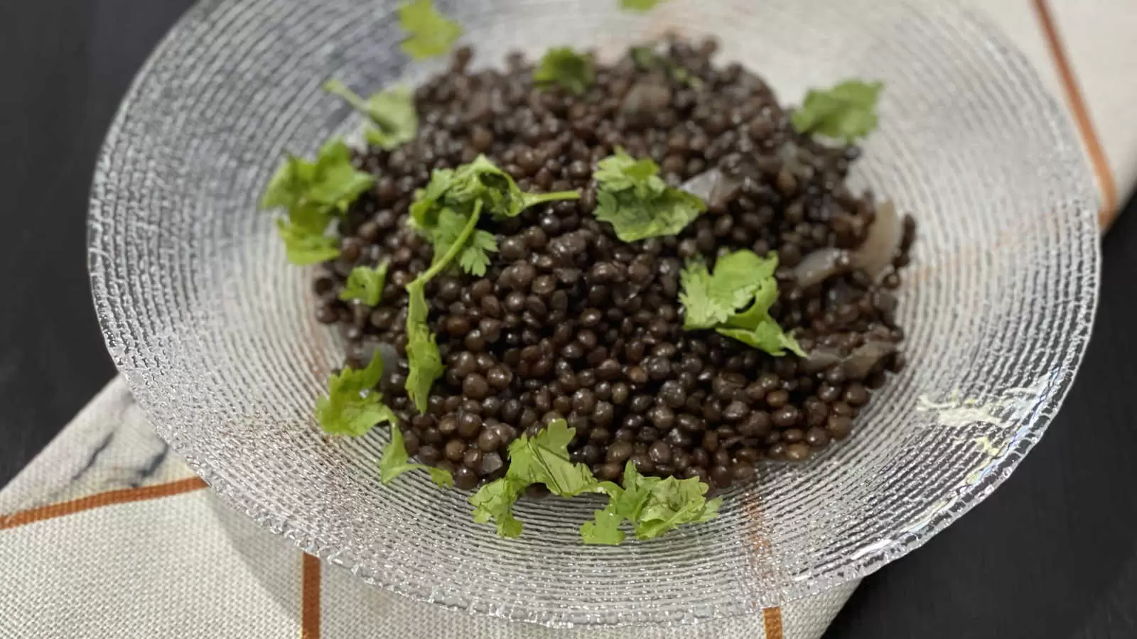 Cooking Lentil stew in a glass dish