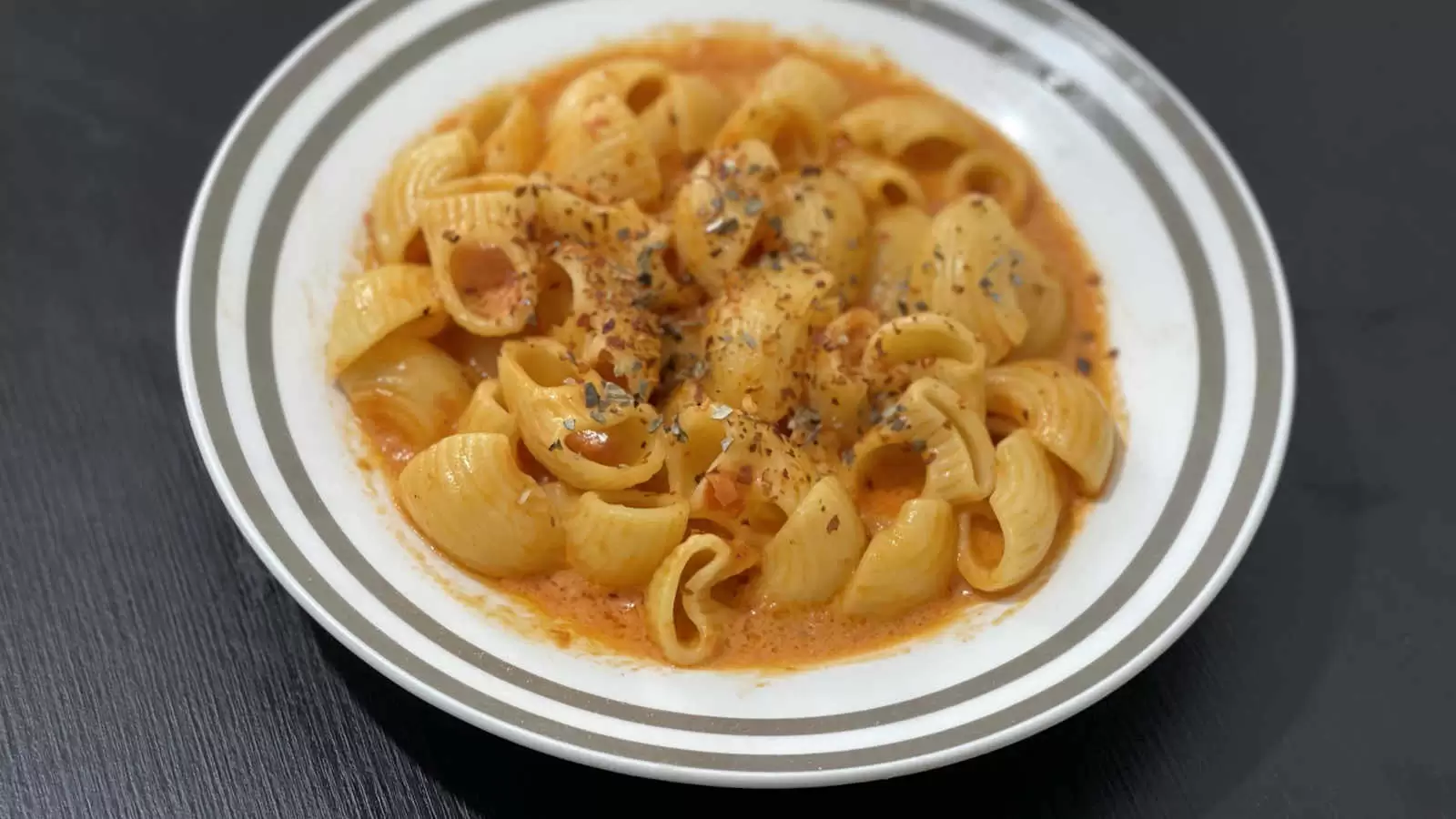 Creamy Tomato Pasta dinner in a plate on a table