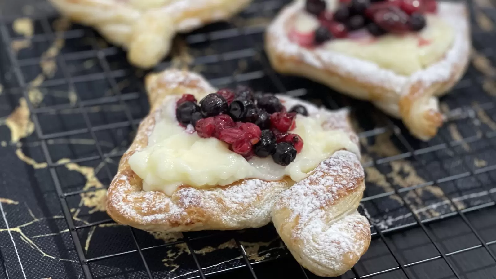 Delicious Danish pastry on a cooling rack