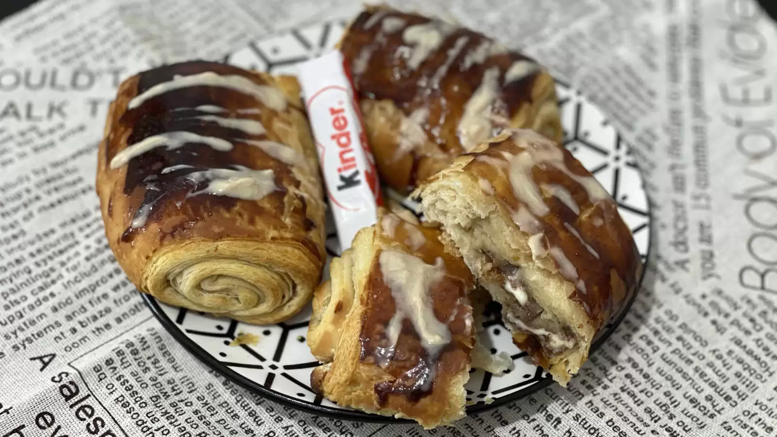 Delicious Kinder Bueno Croissant on a plate Kinder Bueno chocolate in the middle napkin underneath