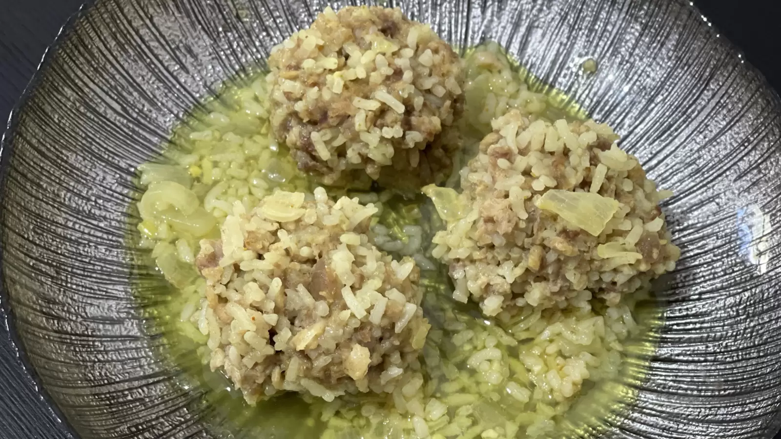 Delicious Porcupine Meatballs in Onion Sauce on a Plate