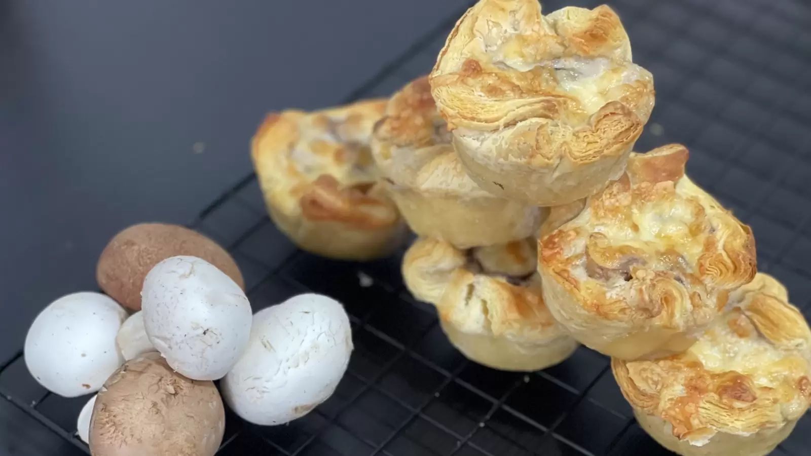 Mushroom and Caramelized Onion Puff Pastry Tart dish on cooling rack