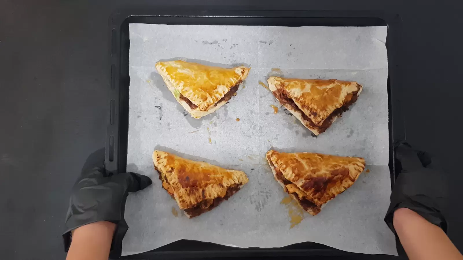 Puff pastry smores on a tray after coming out of the oven