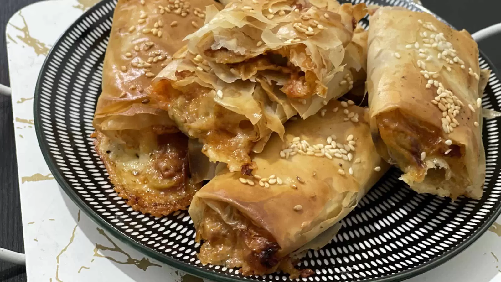 Filo Pastry Pizza dish on a plate on a white gold tray