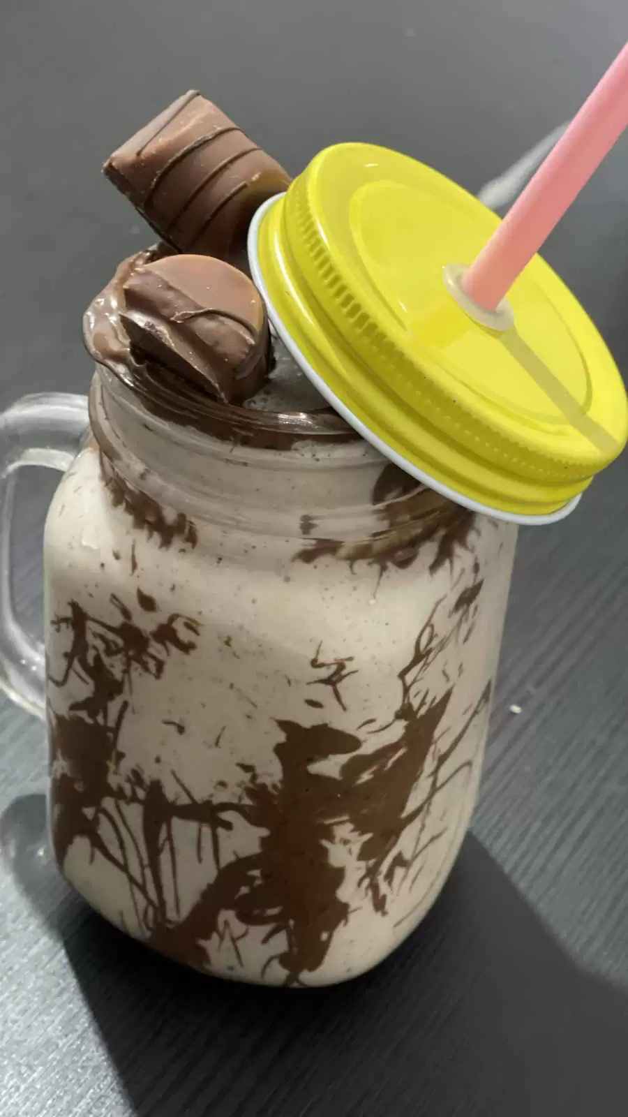 Milkshake Hersheys and Nutella in a glass and a straw