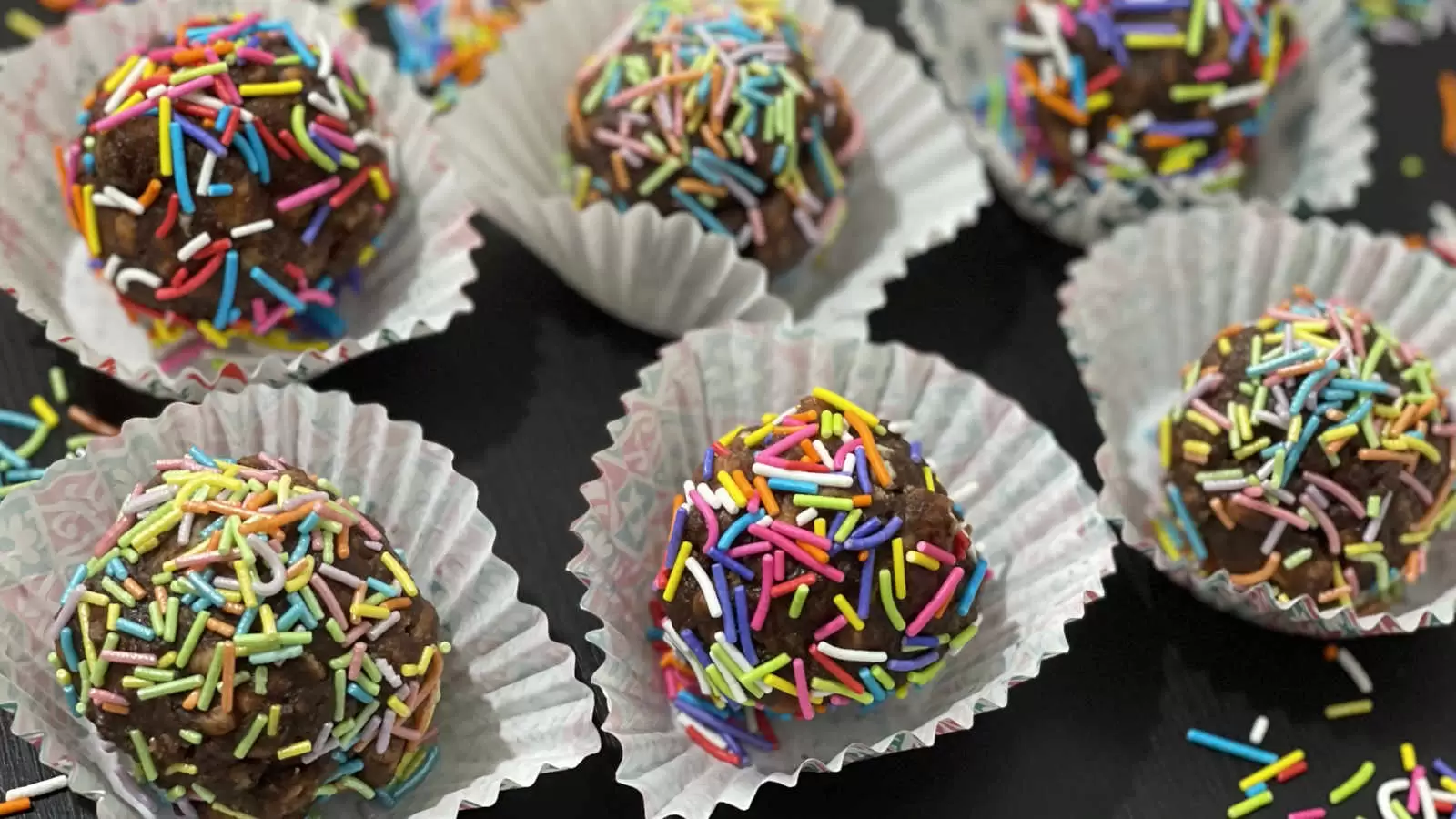 Homemade Chocolate balls with rainbow sprinkles in baking cups