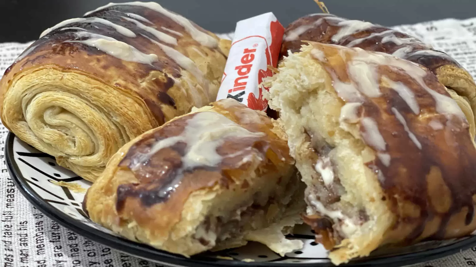 Homemade Kinder Bueno Croissant on a plate Kinder Bueno chocolate in the middle napkin underneath