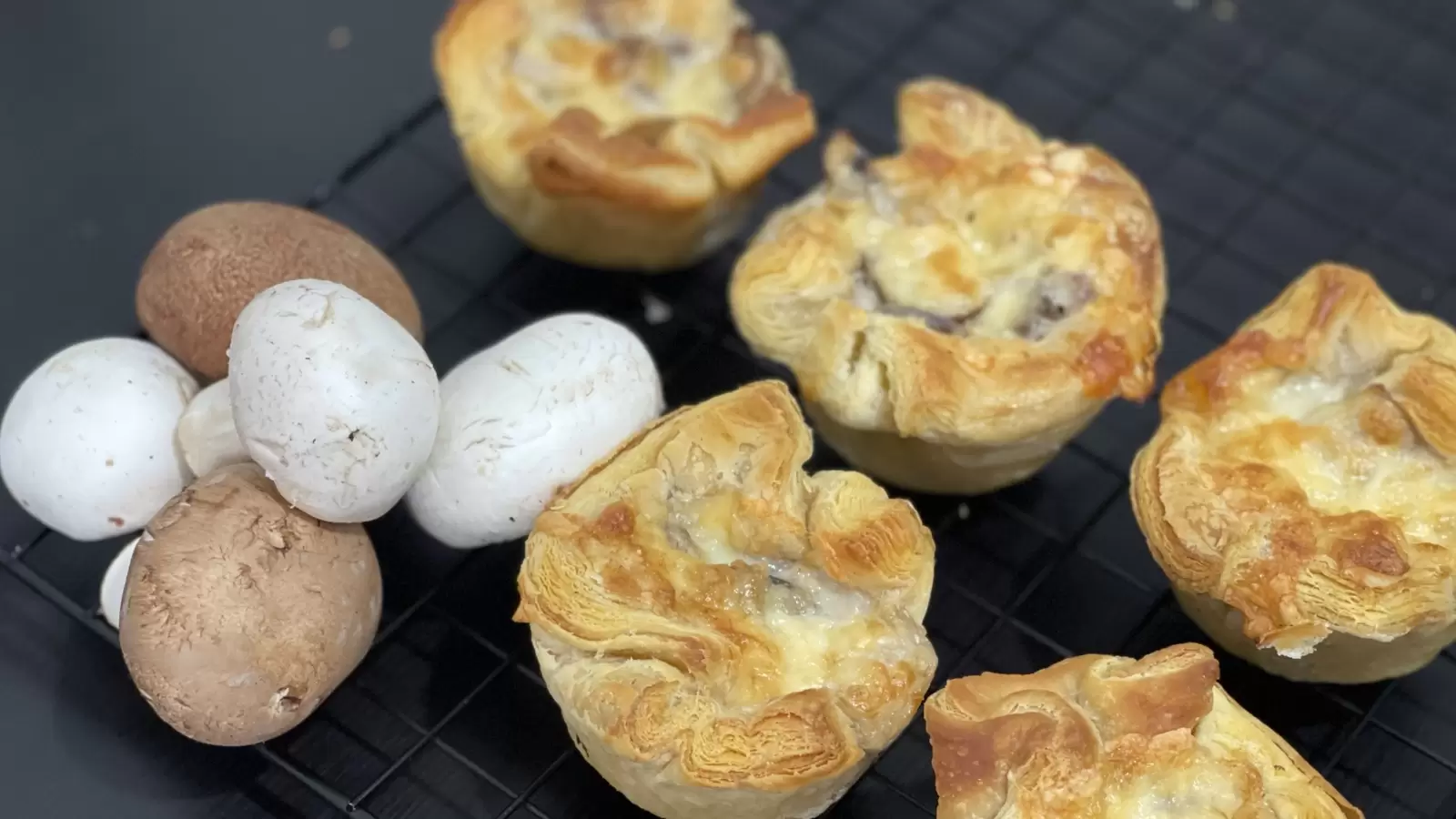 Homemade Mushroom and Caramelized Onion Puff Pastry Tart on cooling rack