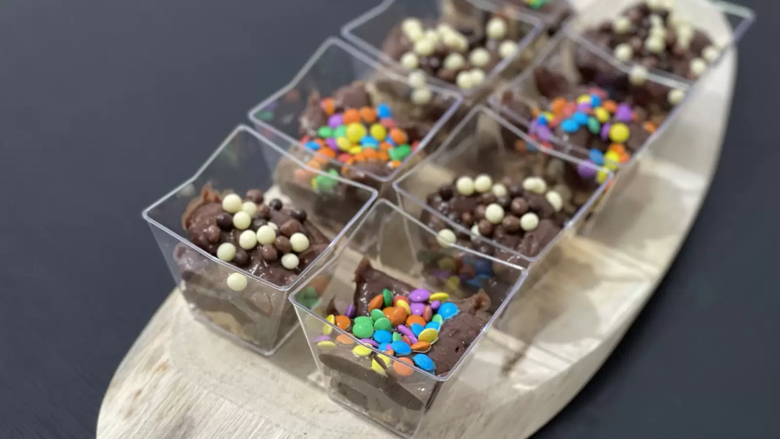 Homemade Oreo Pudding Cups on a Wooden Tray