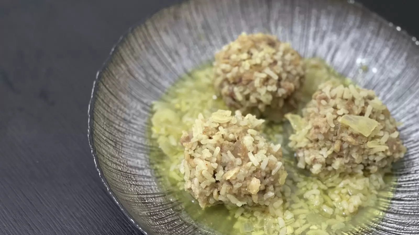 Homemade Porcupine Meatballs in Onion Sauce on a Plate