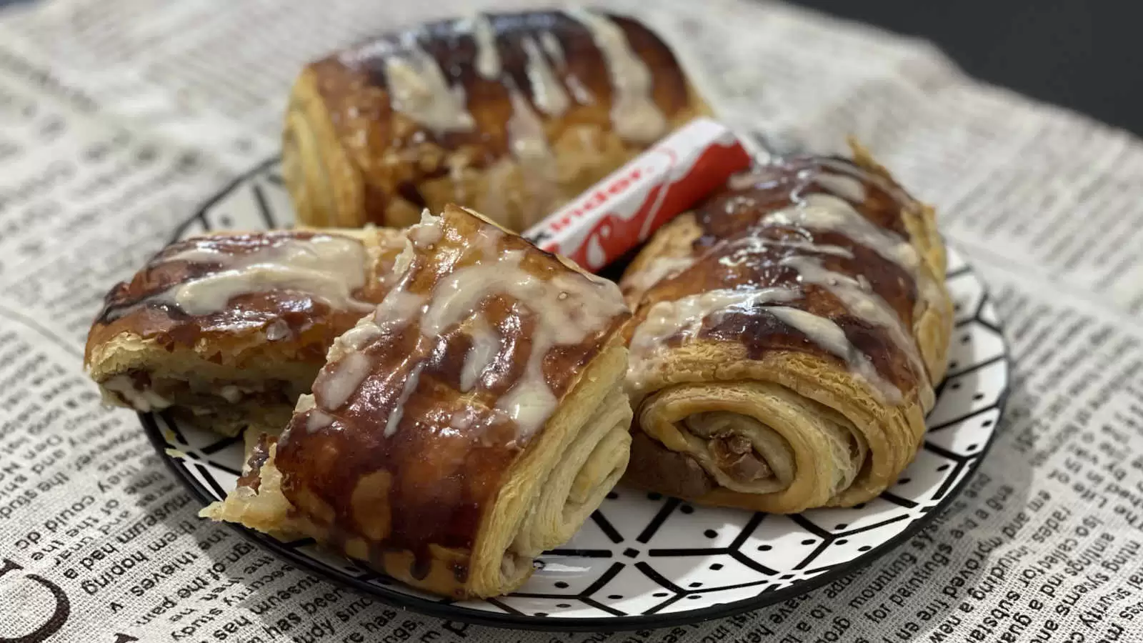 Kinder Bueno Croissant dish on a plate Kinder Bueno chocolate in the middle napkin underneath