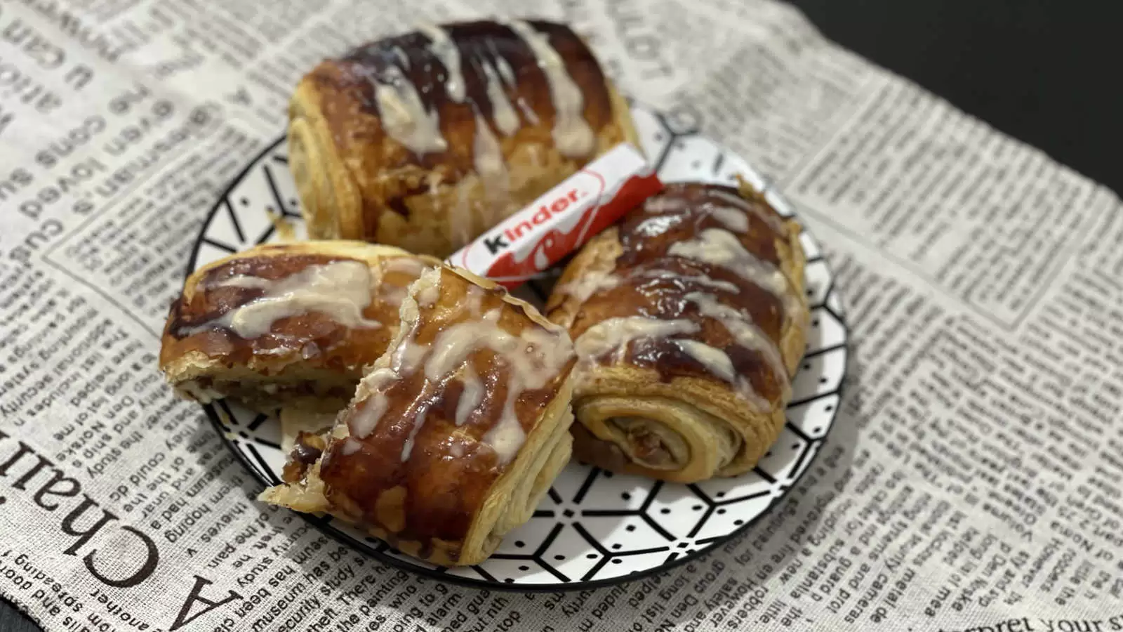 Recipe for Kinder Bueno Croissant on a plate Kinder Bueno chocolate in the middle napkin underneath