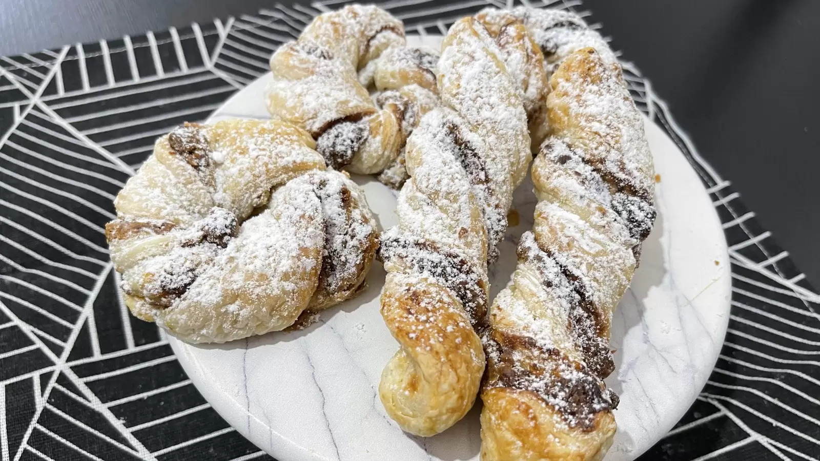 Kinder Bueno Stuffed Puff Pastry dessert on a plate on a tablecloth