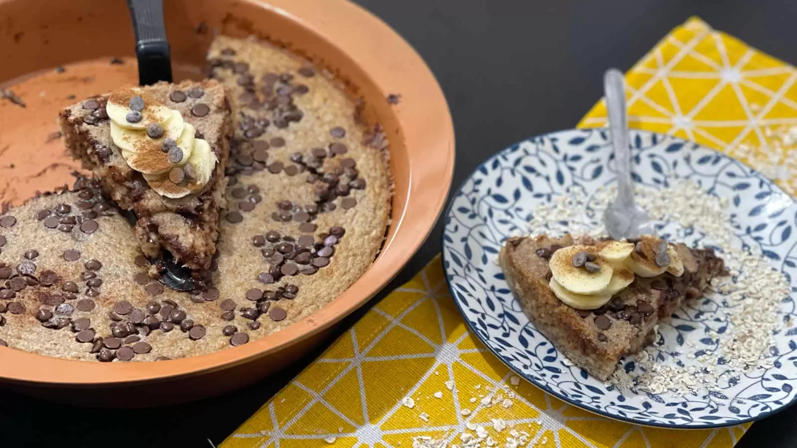 Oatmeal Banana Bread cake in a pan a piece of Oatmeal Banana Bread on a plate