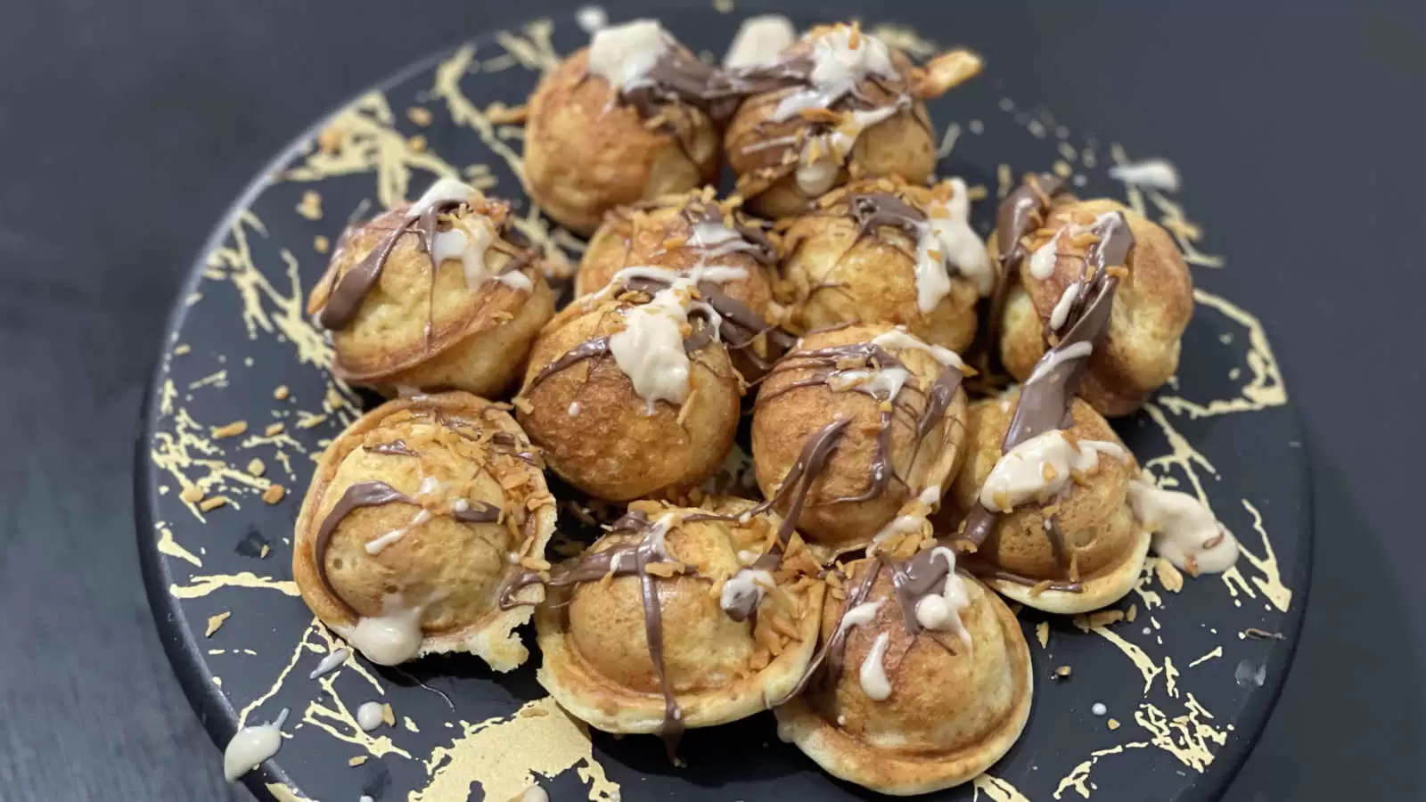 Pancake balls with Nutella and Kinder Bueno on a plate