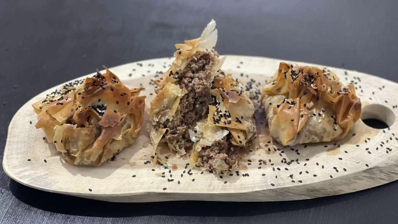 Three Phyllo Dough Beef Pie on a wooden board