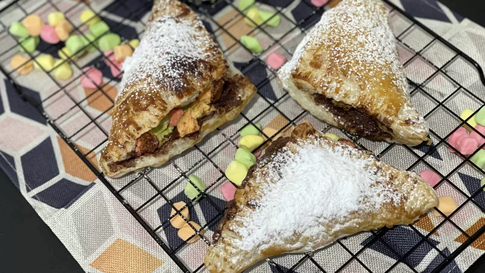 Three puff pastry smores on a tray