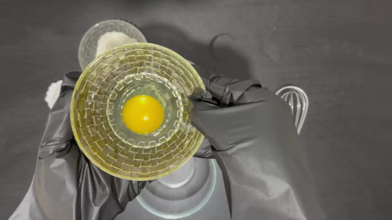 Bowl with egg, empty bowl, and bowl with flour