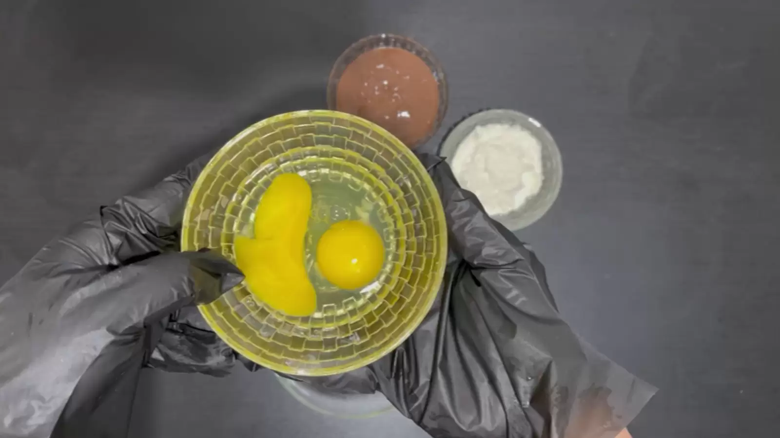Bowl with eggs, bowl with flour, bowl with Nutella.