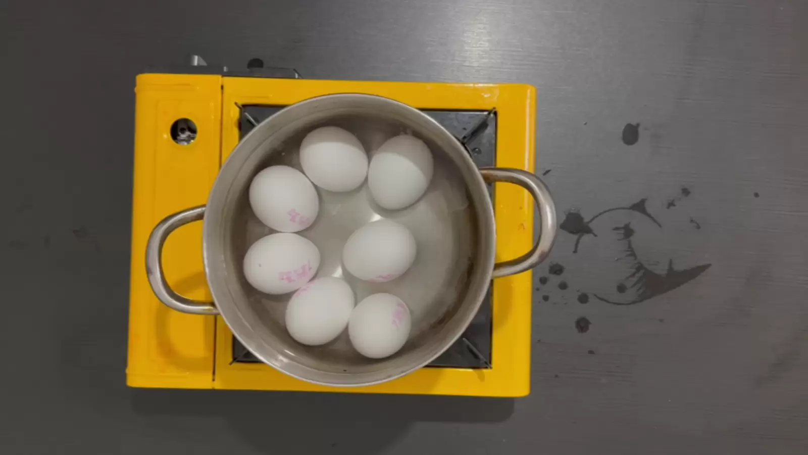 Pot with eggs on a gas stove