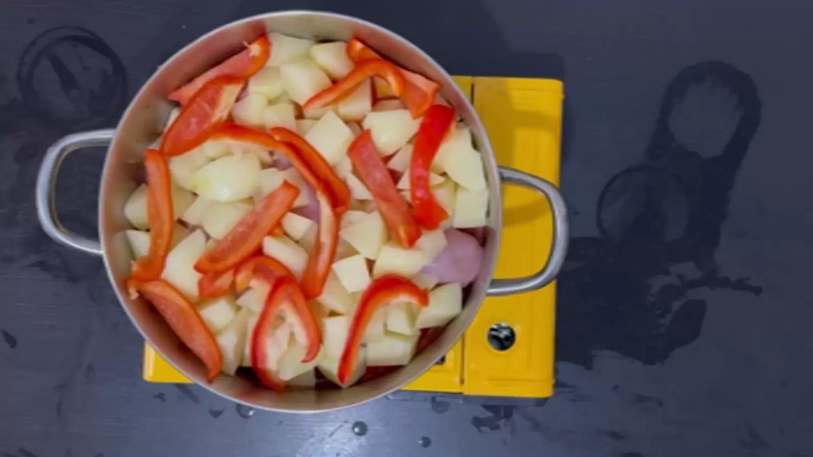 Pot with potatoes, red pepper