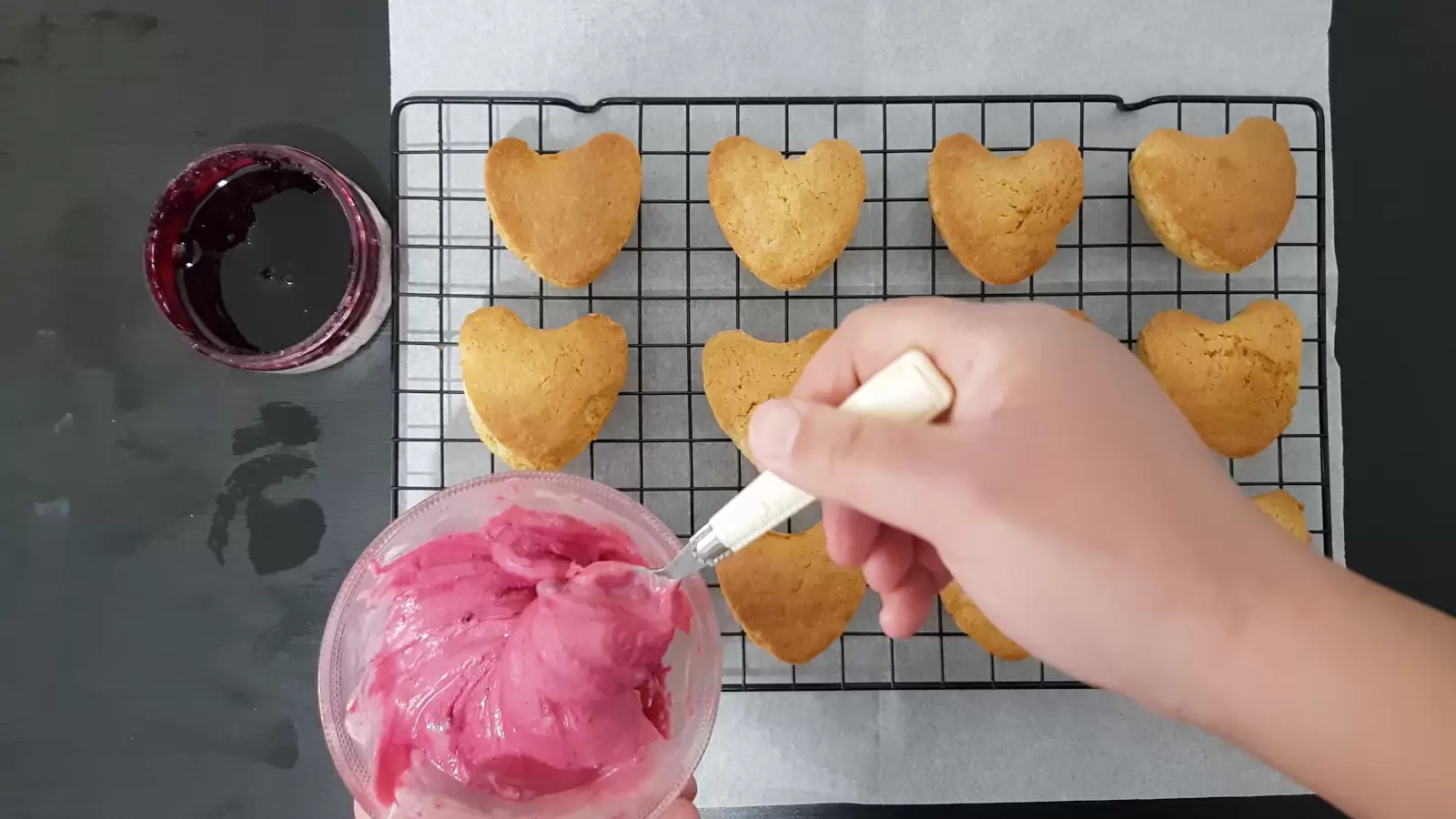 Bowl with berries, bowl with berries and white chocolate spread, vanilla cupcakes, spoon, cooling rack, baking paper