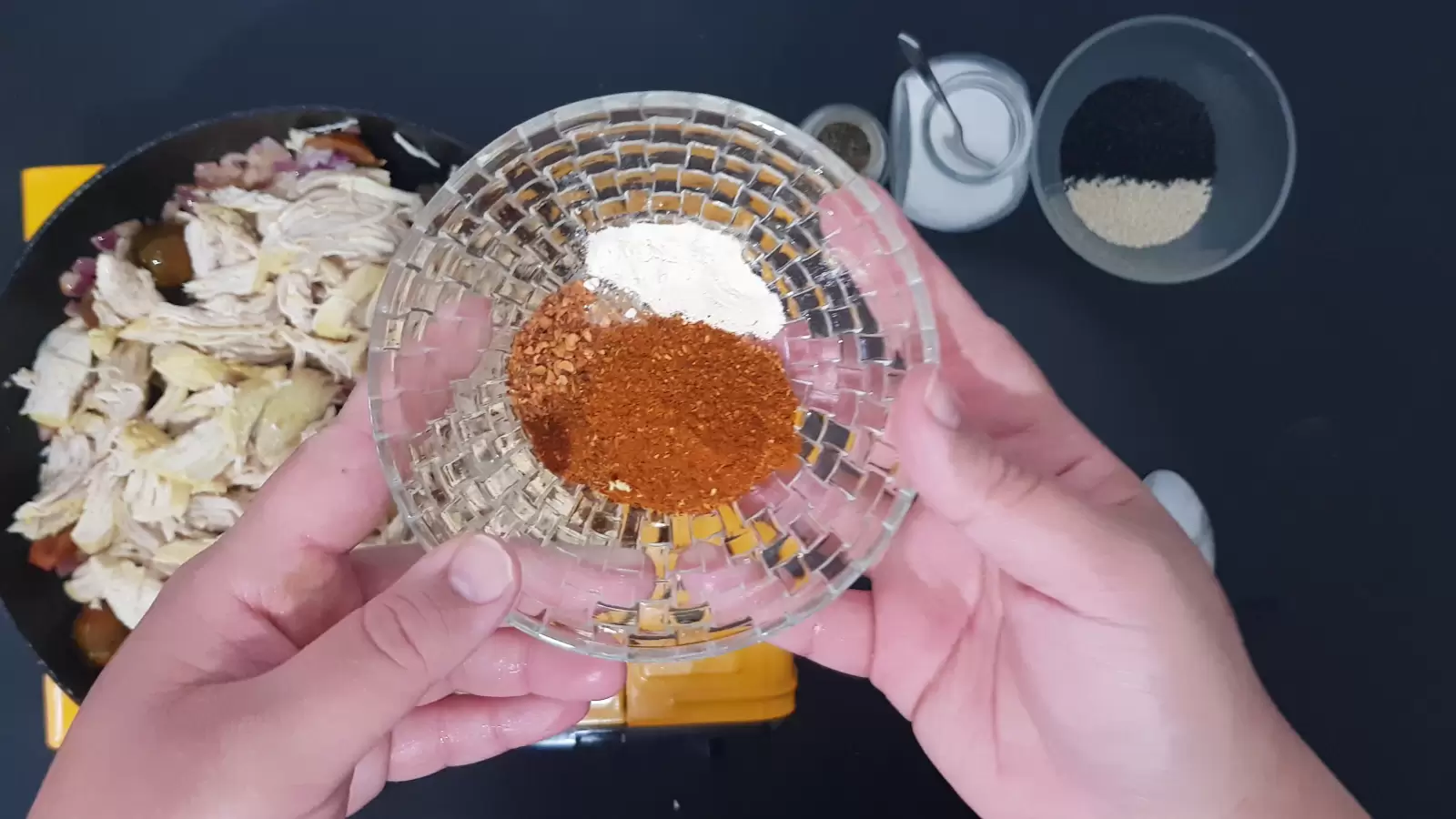 Red paprika, garlic powder and ground chili in a bowl