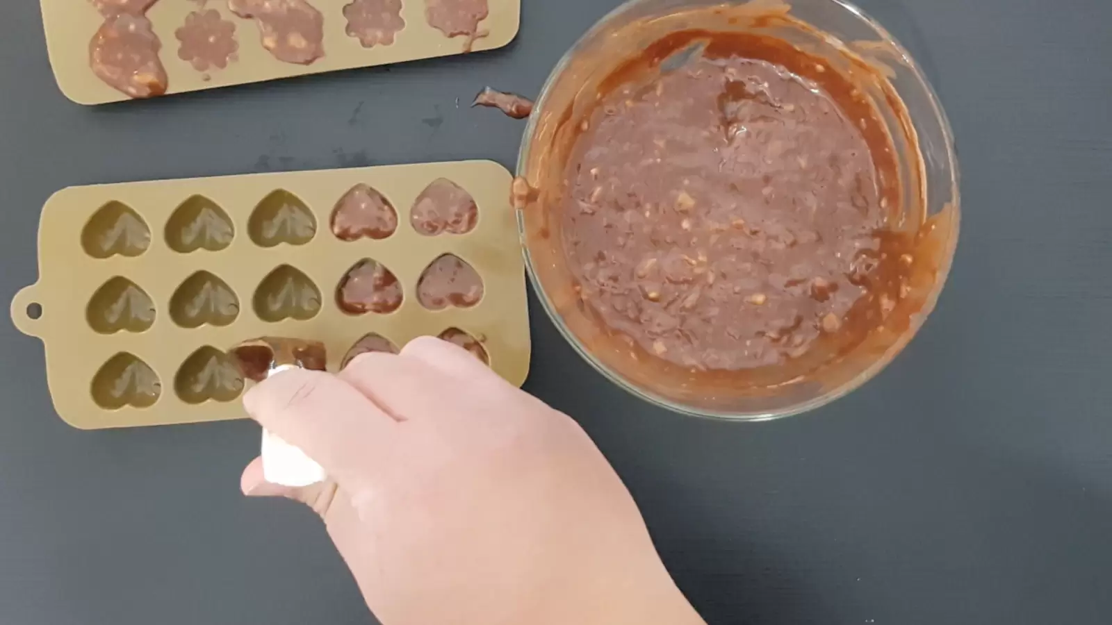 Bowl with chocolate and banana mixture, pan