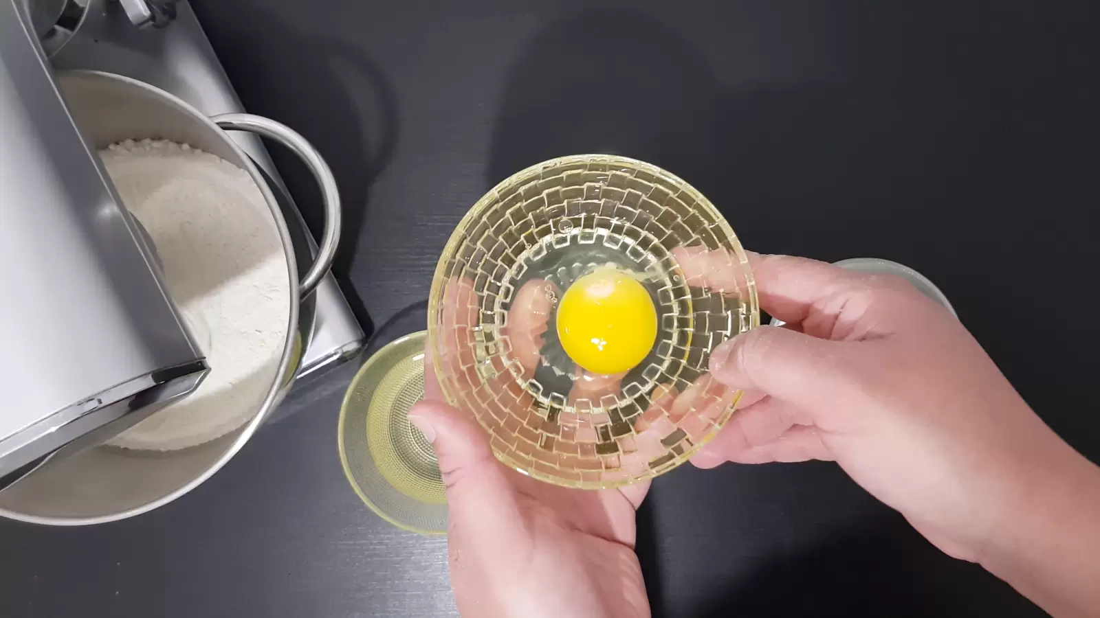 Bowl with egg, bowl with oil, mixer with mixture