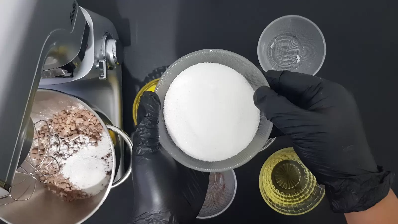 Empty bowl, bowl with oil, bowl with sugar, mixer with bowl