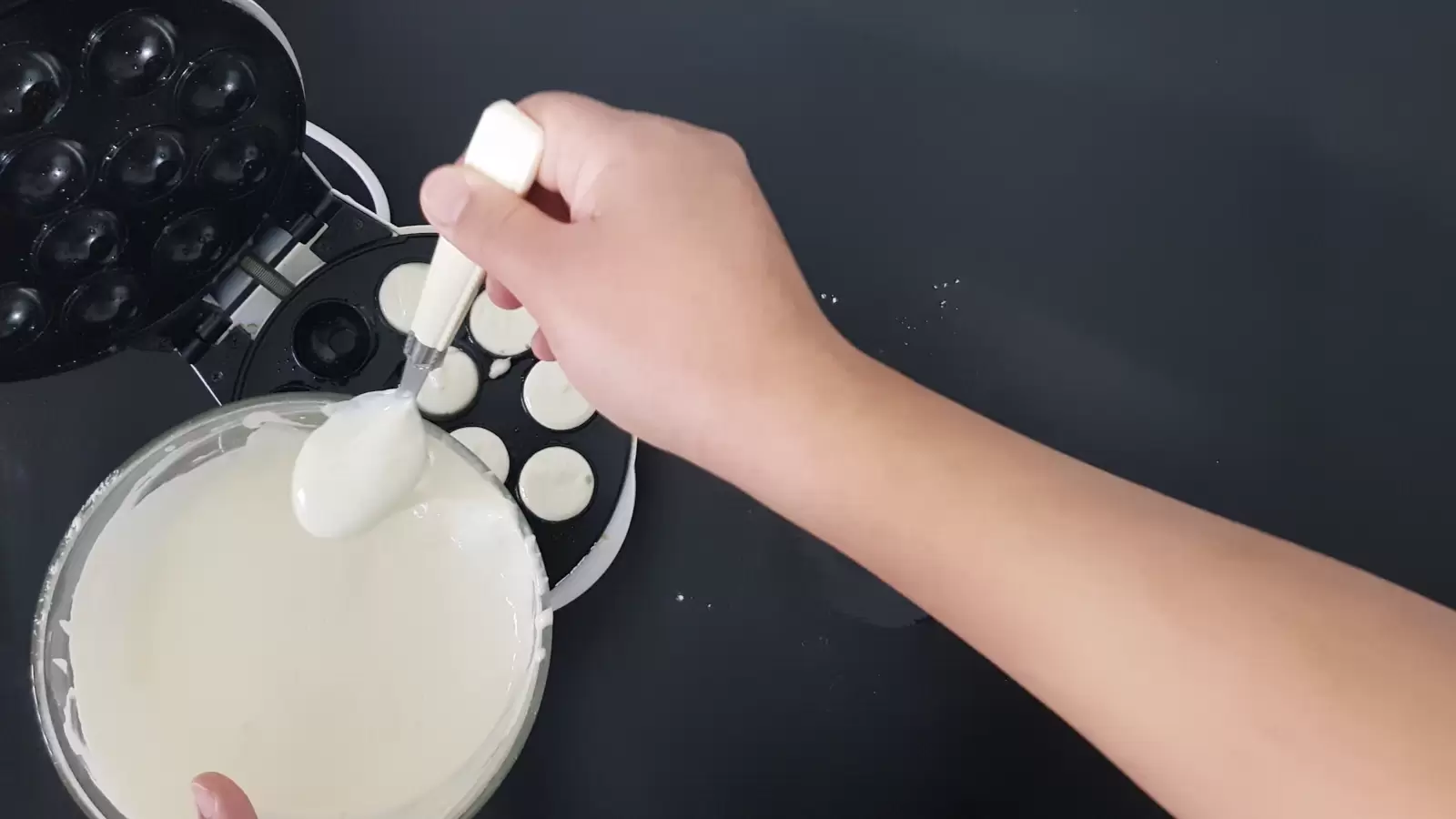 Mix in a bowl with a spoon, a device for making pancake balls