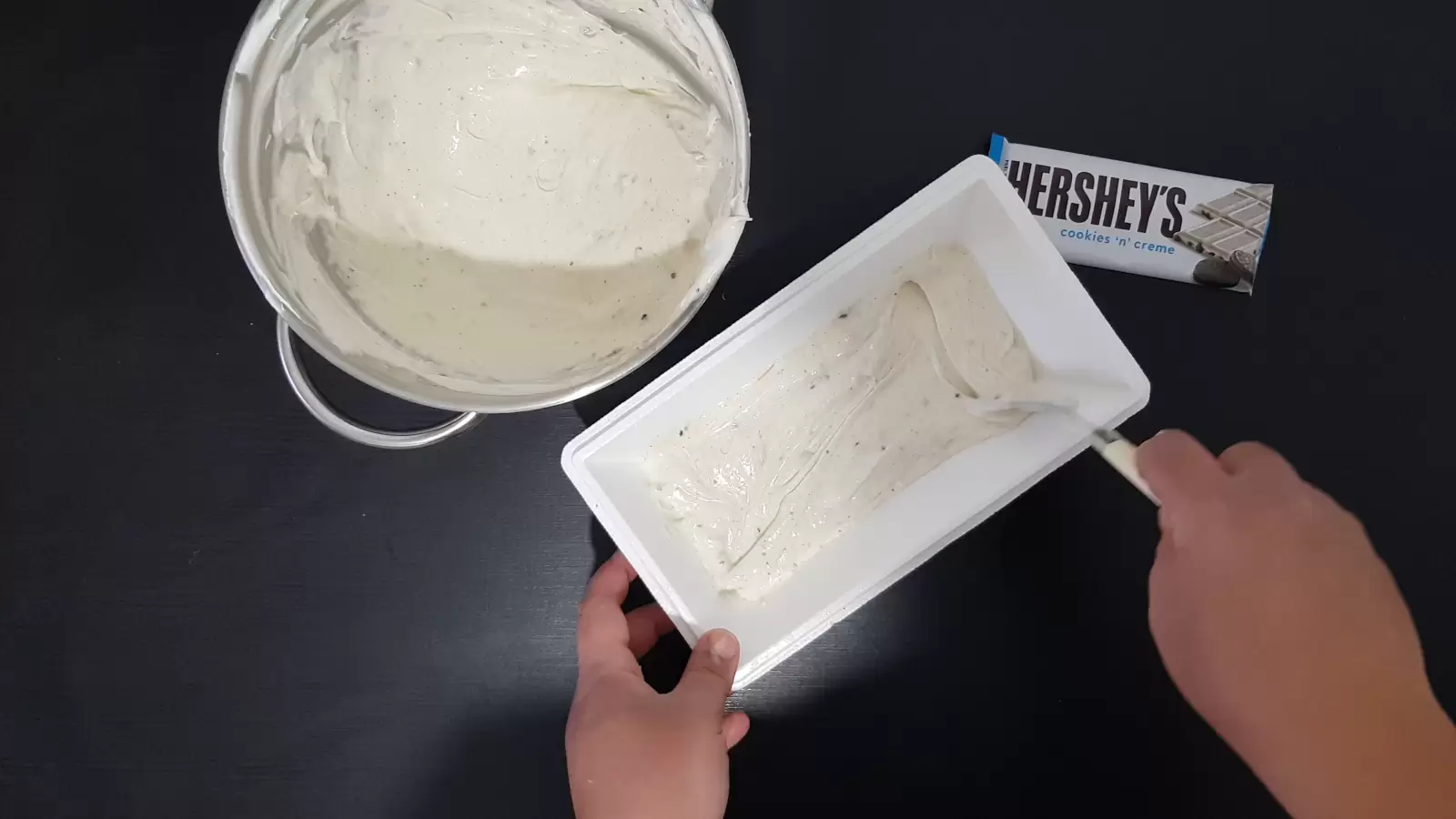 a bowl with ice cream mix, a pack of Hershey chocolates, an ice cream box and the ice cream mix