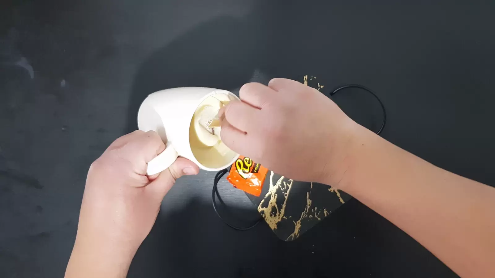 Reeses ice cream in a mug with white chocolate