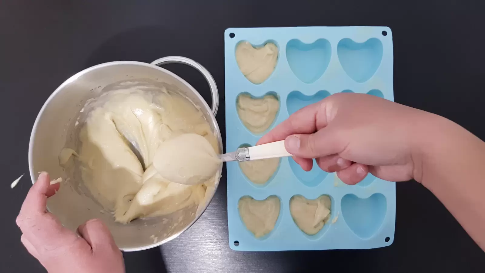 Rubber cupcake mold, bowl with mixture, spoon