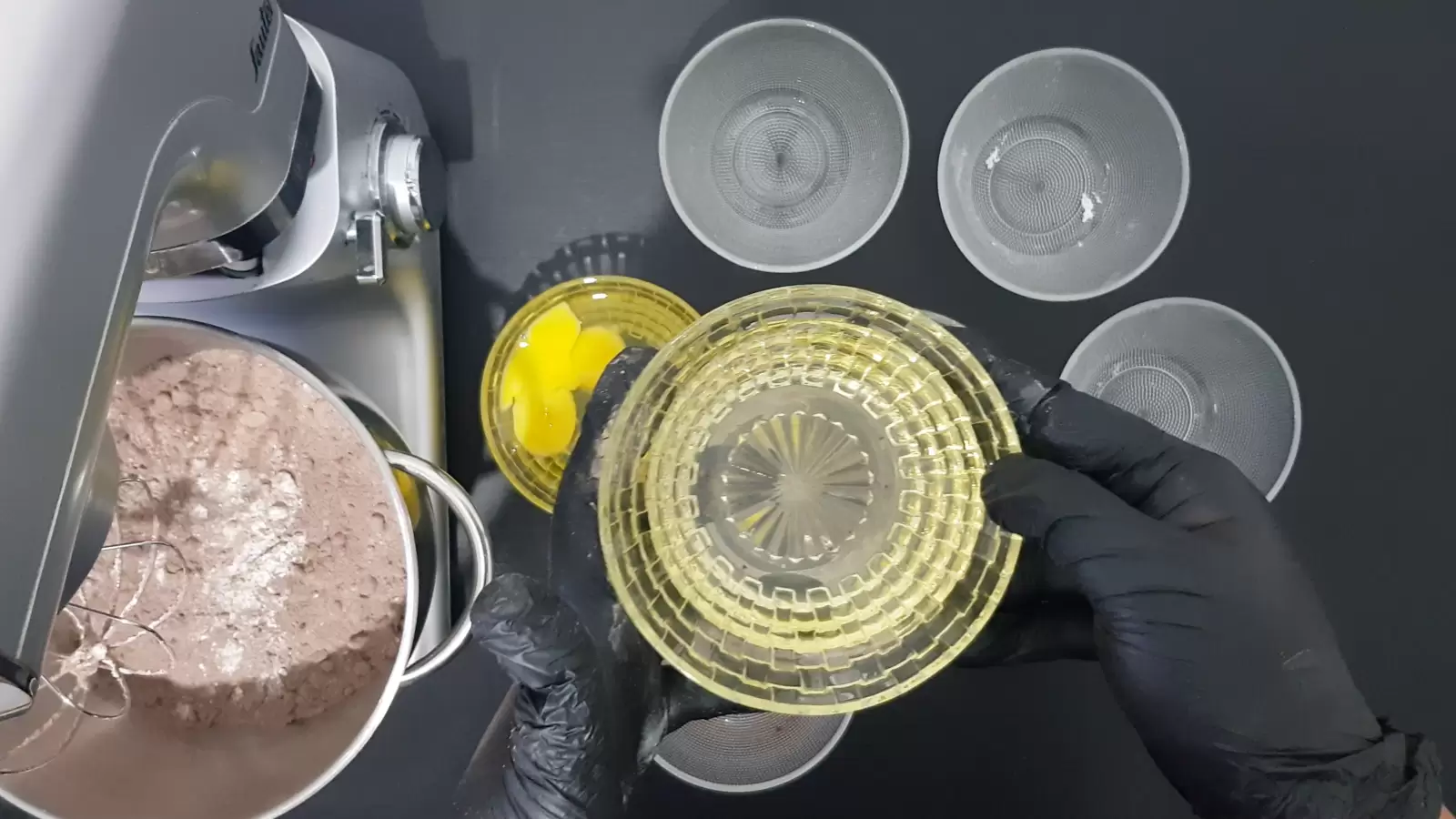 4 empty bowls, bowl with oil, bowl with eggs, mixer and a bowl