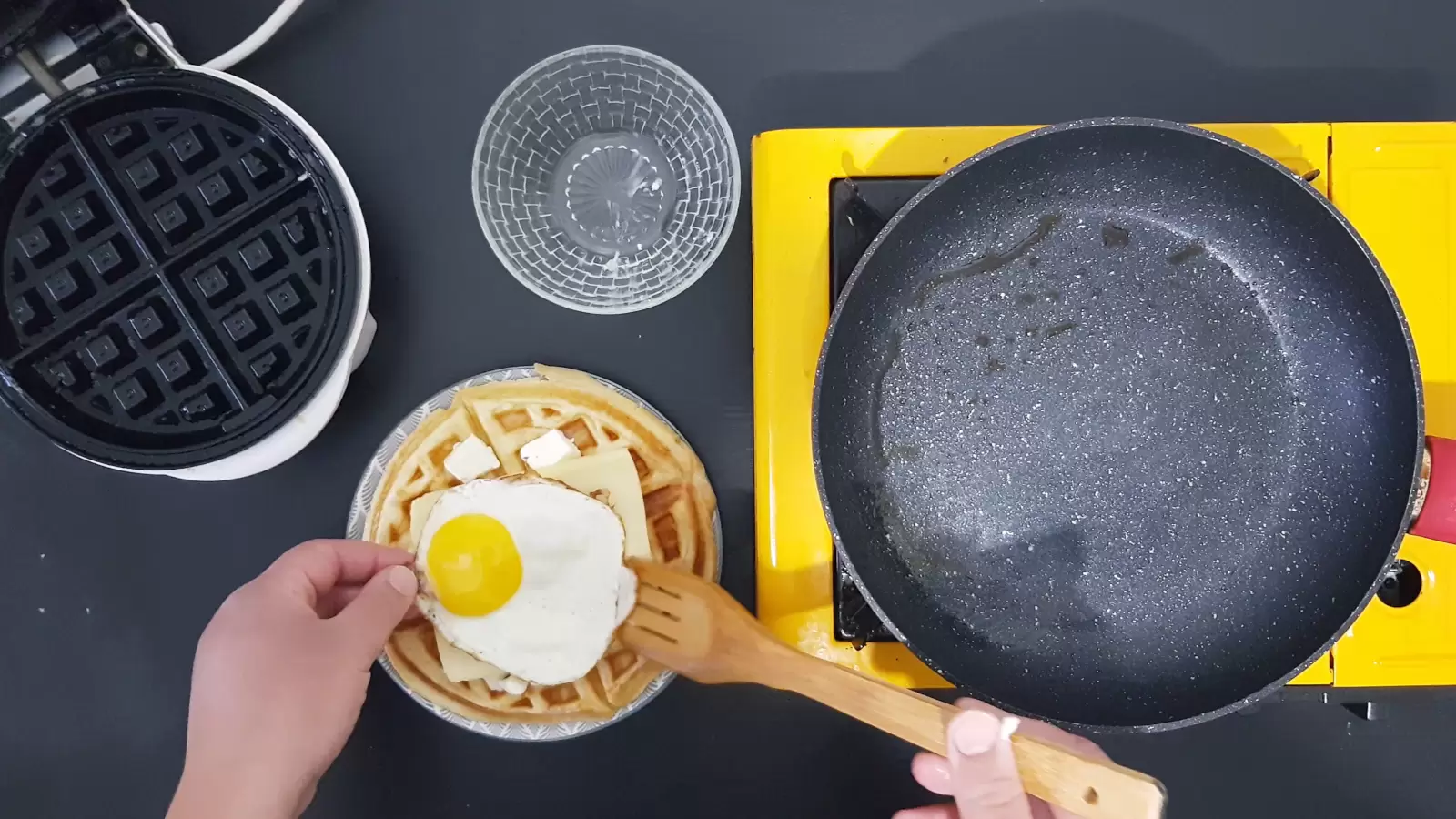 pan. empty bowl Egg on a Belgian waffle.