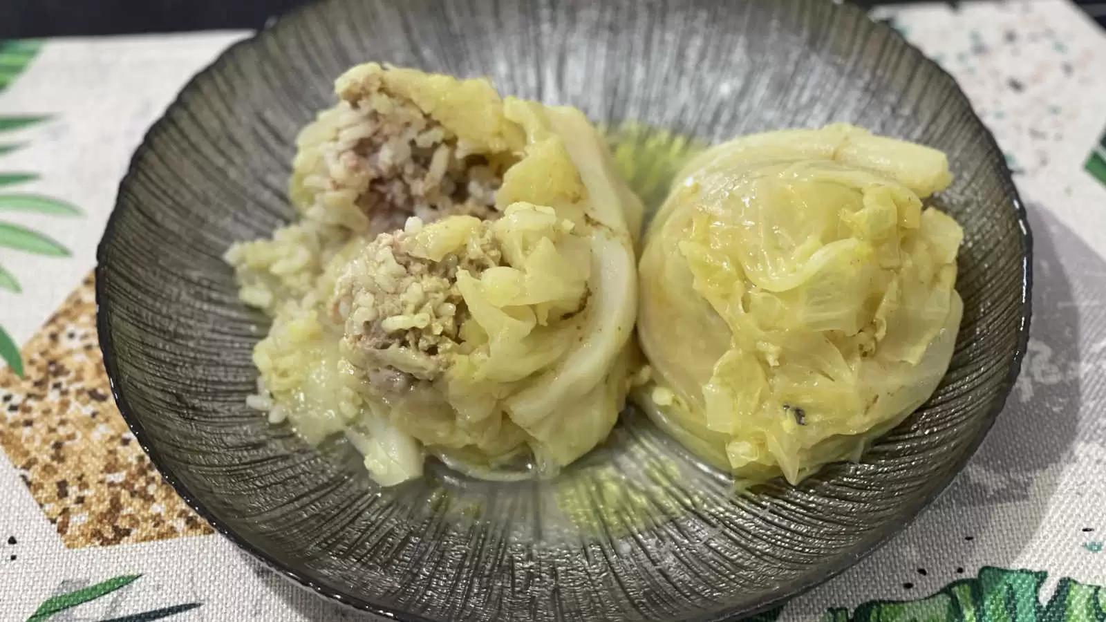 Stuffed Cabbage With Beef And Rice recipe a plate with the dish a napkin underneath