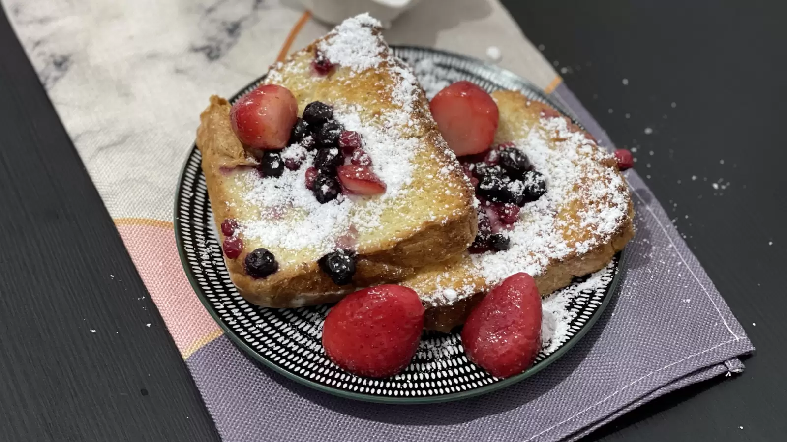 Tasty Berry Bread Pudding on a plate on a table