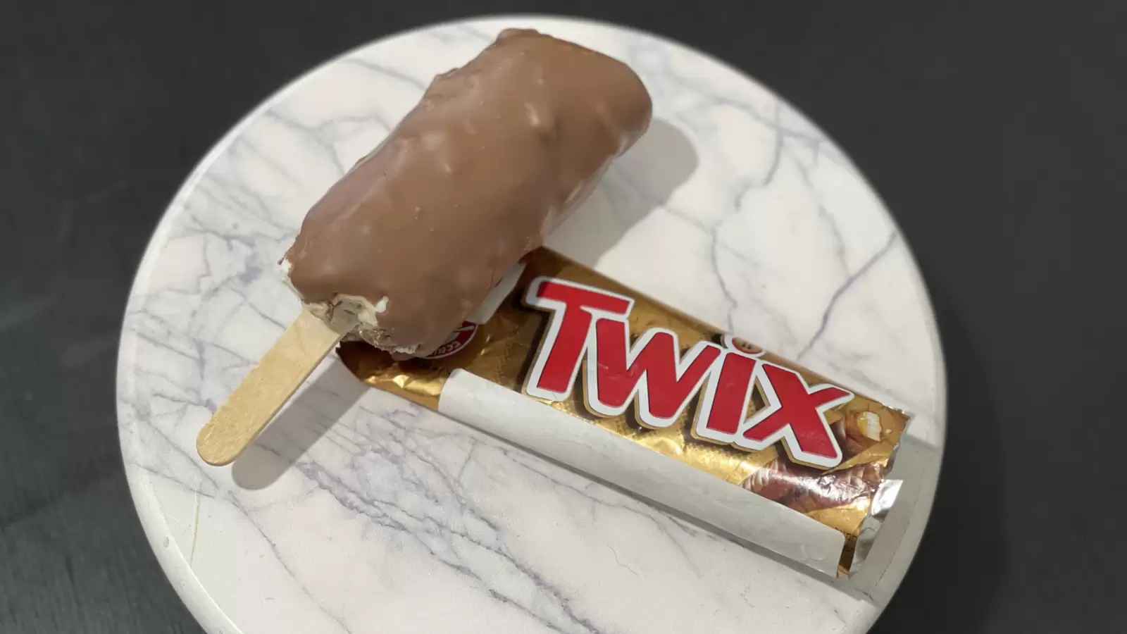 Tasty Twix ice cream a package of Twix placed on the table