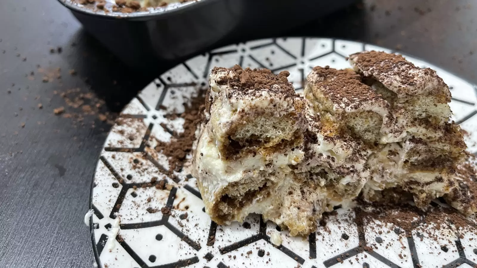 A piece of tiramisu dish on a plate