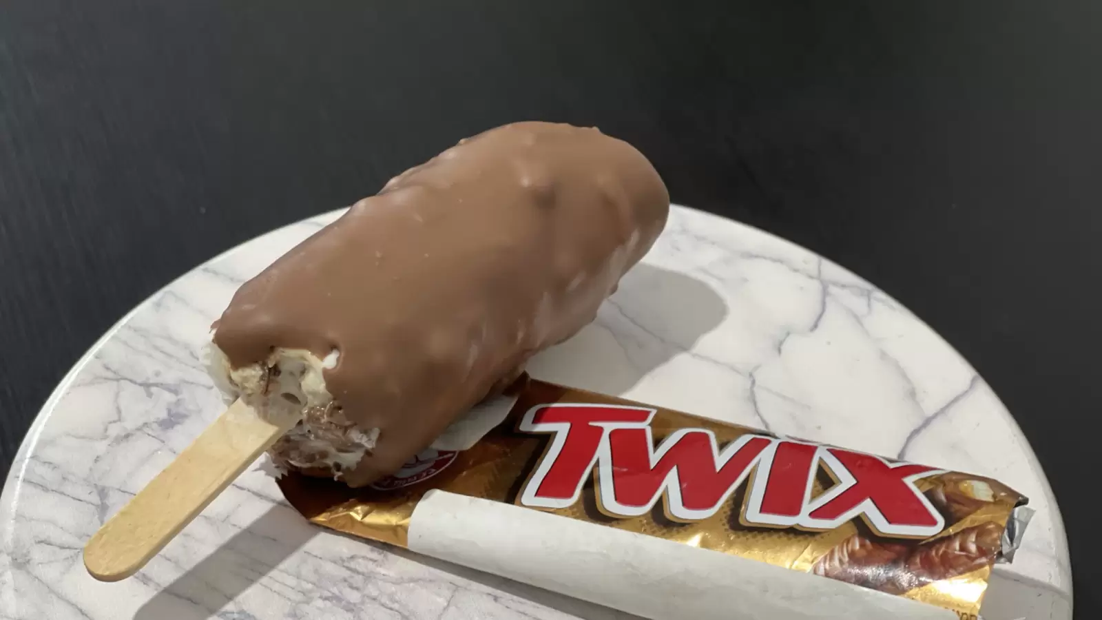 Twix ice cream dish a package of Twix placed on the table